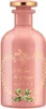 A pink Gucci perfume bottle with gold accents and green ribbon detail. Anteprima dell’immagine prodotto