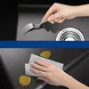 A split image showing a hand holding a fork over a sink and another hand cleaning the sink with a cloth. Produktbild-Vorschau