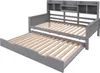 A gray daybed with a pull-out trundle bed and a shelf unit at the headboard, shown against a white background. Náhled obrázku produktu