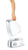 A hand is holding the top part of a humidifier, showing it detached from the base. Podgląd zdjęcia produktu