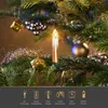 Close-up of LED Christmas tree candles on a decorated Christmas tree branch. Produktbild-Vorschau