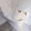 Bild einer abgerundeten, weißen Badewanne in hellem Badezimmer mit einer Ansicht von oben. Produktbild-Vorschau