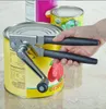 A hand is using a can opener to open a yellow can of tomatoes. Voir les images du produit