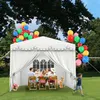 A family and a dog are enjoying a party under a white tent in a backyard. Voir les images du produit