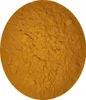 A close-up, top-down view of a pile of yellow powder, likely turmeric, filling a circular frame. Náhľad obrázku produktu