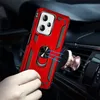 A hand holding a red phone case with a ring holder, which is magnetically attached to a car vent mount. Produktbild-Vorschau