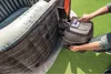 A person is interacting with the control panel of an inflatable hot tub. Voir les images du produit