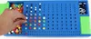 A hand is placing a yellow bead into a blue game board. Anteprima dell’immagine prodotto