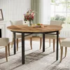 A round dining table with chairs in a dining room setting. Podgląd zdjęcia produktu
