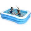 Two women are playing in an inflatable swimming pool. Podgląd zdjęcia produktu