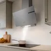 A modern kitchen scene with a sleek range hood over a stovetop, a pot emitting steam, and kitchen cabinets. Náhled obrázku produktu