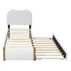 A white upholstered bed frame with a pull-out trundle bed, shown from the side. Náhled obrázku produktu