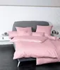 A neatly made bed with pink bedding in a bedroom setting. Produktbild-Vorschau
