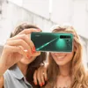 Two young women taking a selfie with a Huawei P40 Lite 5G phone. Produktbild-Vorschau