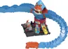 A Hot Wheels toy car track set featuring a monster-like structure with a car inside its mouth and a track extending from it. Voir les images du produit