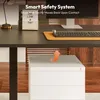 A desk setup with a monitor, keyboard, and a filing cabinet below, featuring a graphic indicating a safety feature. Produktbild-Vorschau