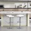 A modern kitchen island with two white bar stools. Produktbild-Vorschau