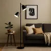 A modern living room scene featuring a floor lamp, sofa, and side table. Náhled obrázku produktu