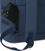 A close-up of a navy blue backpack with a smartphone in a zippered pocket. Voir les images du produit