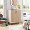 A shoe cabinet is shown in a bedroom setting, next to a chair and a bed. Anteprima dell’immagine prodotto