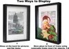 Two shadow boxes are shown side-by-side, demonstrating different ways to display items. The left box shows a framed black and white photograph of a building and cars. The right box displays a baby in a Santa hat with Christmas decorations, showcasing the 3 Produktbild-Vorschau