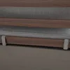 Close-up of a sofa cushion and wooden frame. Náhled obrázku produktu