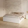 A white bed with bedding and pillows in a bedroom setting. Produktbild-Vorschau