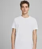 A young man wearing a white t-shirt against a plain background. Produktbild-Vorschau