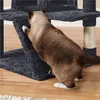 A cat is climbing on a multi-level cat tree with scratching posts and platforms. Produktbild-Vorschau