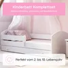 A white children's bed with bedding and a protective rail, set against a soft pink background with draped fabric. Produktbild-Vorschau