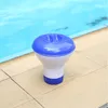A blue and white pool chemical dispenser floats on the edge of a swimming pool. Náhľad obrázku produktu