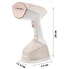 A white and rose gold handheld garment steamer is shown against a white background with dimensions indicated by lines and text. Produktbild-Vorschau