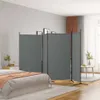 A bedroom scene with a room divider set up behind a bed. Voir les images du produit
