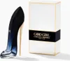 A perfume bottle shaped like a high heel and its packaging are displayed on a white background. Anteprima dell’immagine prodotto
