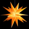 A bright orange star-shaped lantern against a black background. Produktbild-Vorschau
