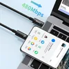 A black USB-C to USB-C cable is shown connecting a smartphone to a laptop. Anteprima dell’immagine prodotto