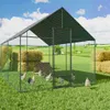A chicken coop with chickens in a grassy field with hay bales. Anteprima dell’immagine prodotto