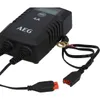 A black battery charger with cables and connectors. Produktbild-Vorschau