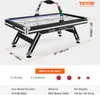 A VEVOR air hockey table is shown in a studio setting with dimensions and contents of the box indicated. Anteprima dell’immagine prodotto