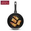 A frying pan with four pieces of cooked fish topped with lemon slices. Produktbild-Vorschau