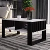 A modern living room setting with a coffee table as the focal point. Produktbild-Vorschau