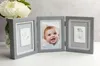 A triptych photo frame with a baby's handprint and footprint impressions, and a photo of a baby. Podgląd zdjęcia produktu