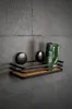 A shelf with bathroom products mounted on a tiled wall. Produktbild-Vorschau