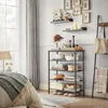 A bedroom setting with a storage shelf and bed. Anteprima dell’immagine prodotto