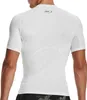 A man wearing a white short-sleeved compression shirt. Produktbild-Vorschau