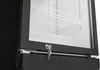 A close-up view of the lower front section of a black refrigerator with a glass door. Produktbild-Vorschau