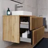 A modern bathroom vanity with a vessel sink and faucet. Produktbild-Vorschau