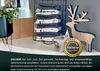 A display of folded kitchen towels with decorative elements. Produktbild-Vorschau