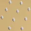 A pattern of small, white and gold objects on a light brown background. Náhľad obrázku produktu