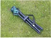 A folded green camping stool lying on grass. Anteprima dell’immagine prodotto